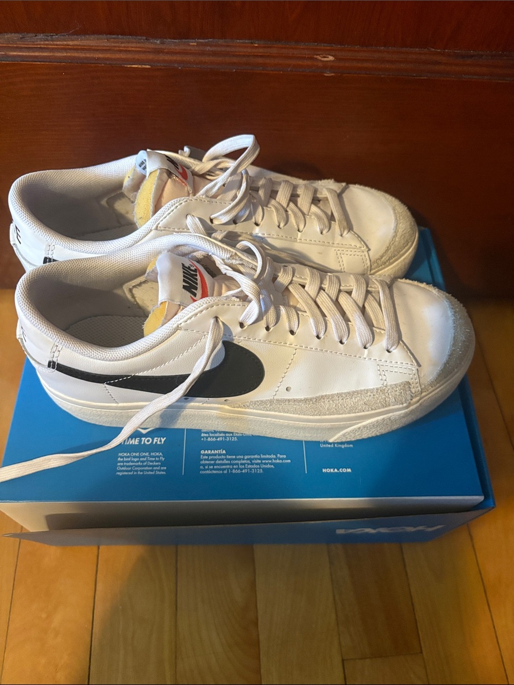 Nike Women’s White Low-Top Sneakers with Black Swoosh